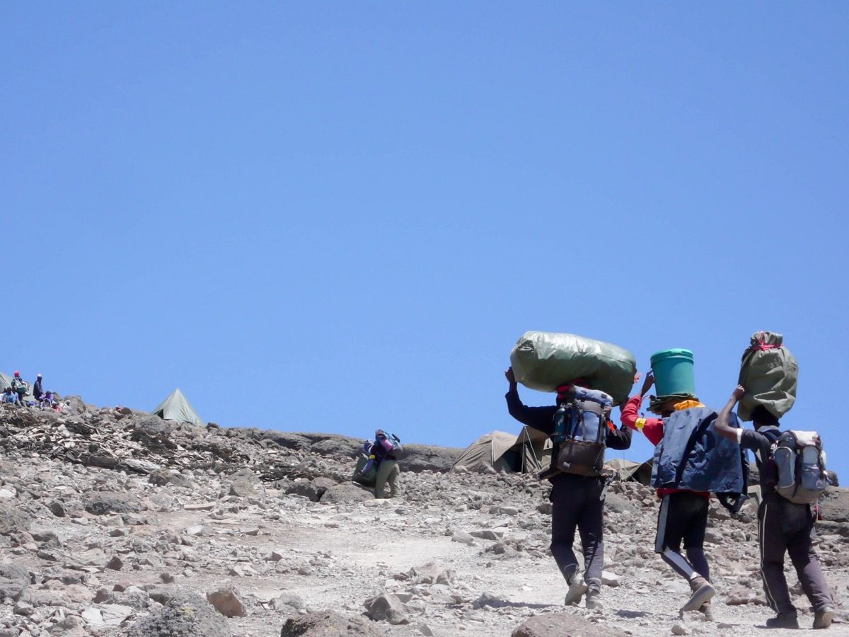 Carrier on the way to the summit of Kilimanjaro