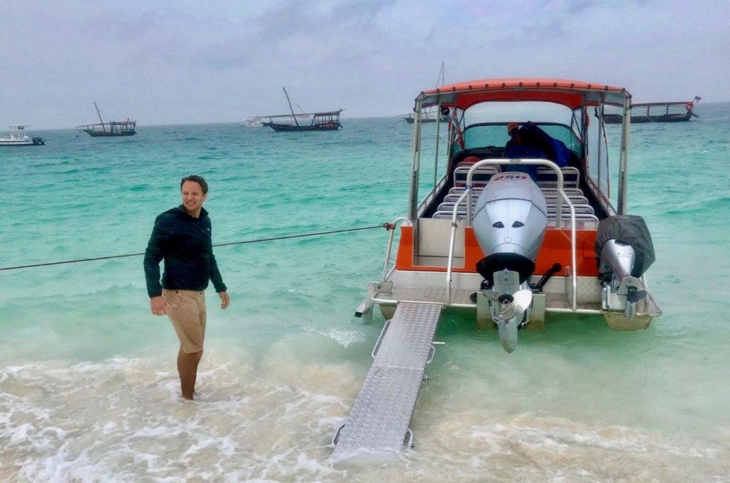 Alex at the beach of Zanzibar after a wild boat trip from Pangani